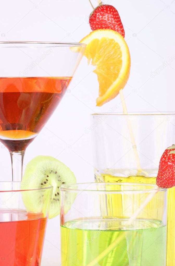 Colored aperitifs in different drinking glasses