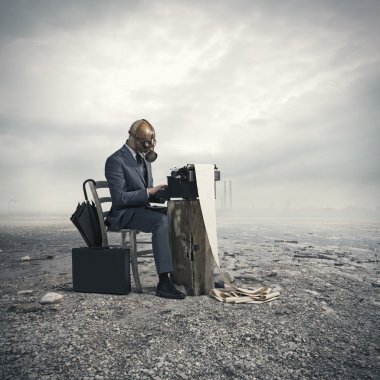 Business wearing a gas mask, write with an old typewriter clipart