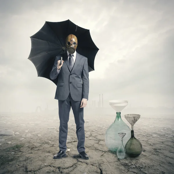 Global Warming:Businessman waiting for the rain — Stock Photo, Image