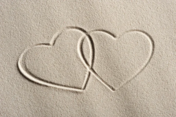 Fondo de playa con dibujos corazones — Foto de Stock