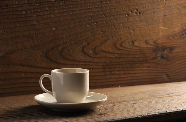 Kopje koffie op de houten tafel — Stockfoto