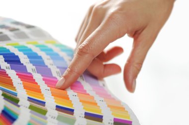 Woman Choosing color from color scale clipart