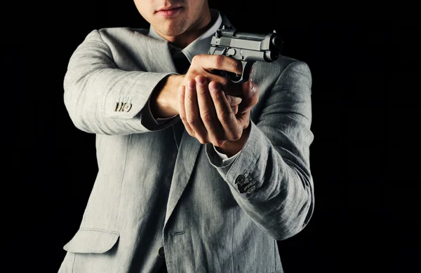 Guy holding a gun — Stock Photo, Image