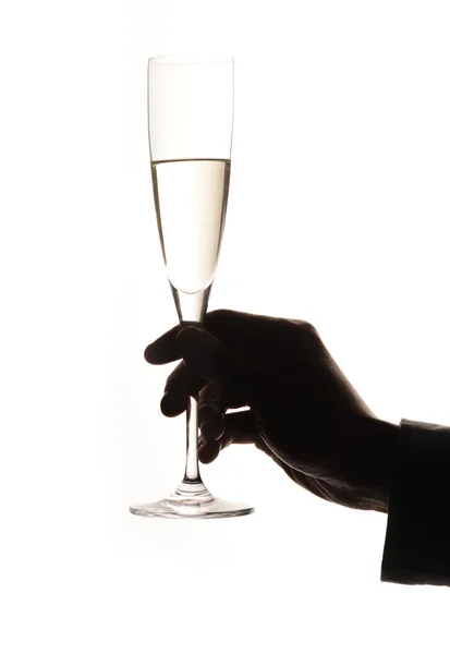 Copo de champanhe na mão de um homem — Fotografia de Stock