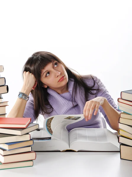 Kvinnlig student med böcker på vit bakgrund — Stockfoto