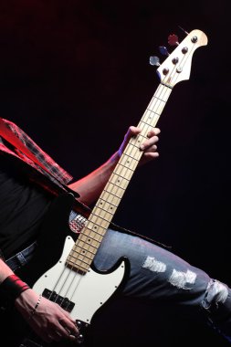 A bassist plays at rock concert clipart