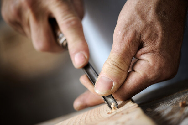 Hands of a carpenter, close up