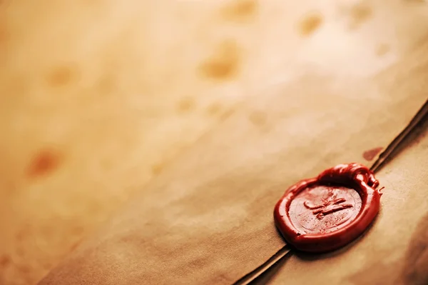 Wax seal on a grunge paper — Stock Photo, Image