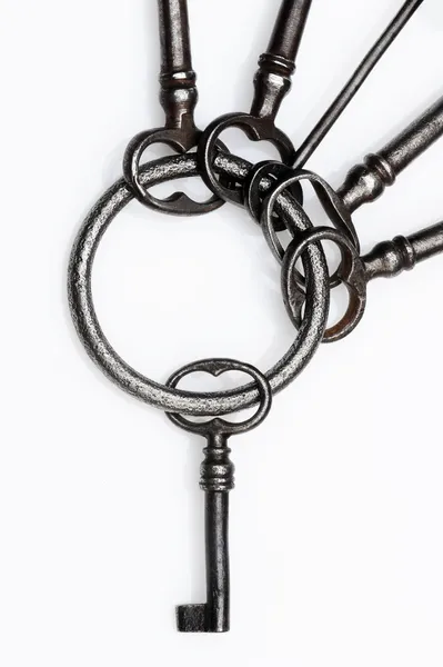 Old keys on white background, close-up — Stock Photo, Image