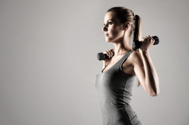 Woman lifting weights clipart