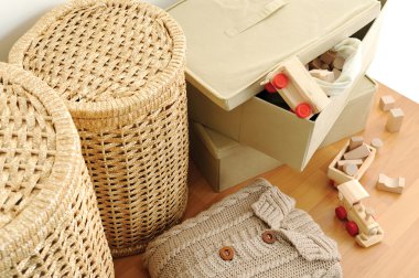 Wicker containers for home, on wooden floor, top view clipart