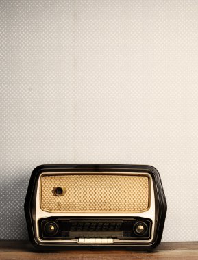 Antique radio on vintage background clipart