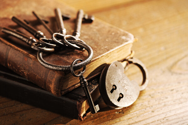 Old keys on a old book, antique wood background