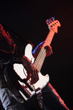 Close up of hands playing an bass clipart