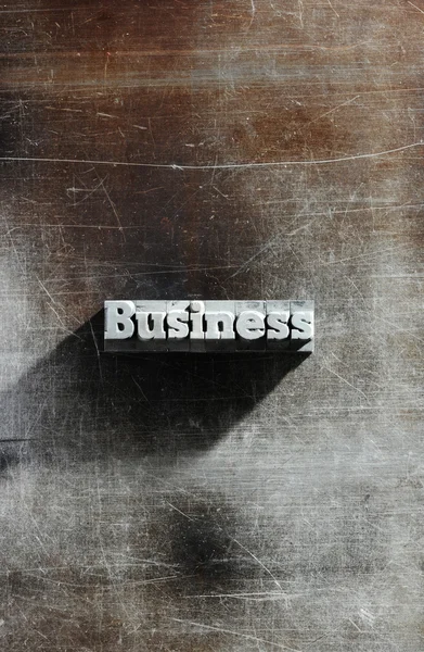 Gammal metalliskt bokstäver: business bakgrund — Stockfoto