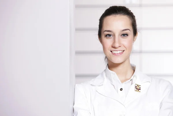 Portrait of a female pharmacist at pharmacy, copy space — Stock Photo, Image