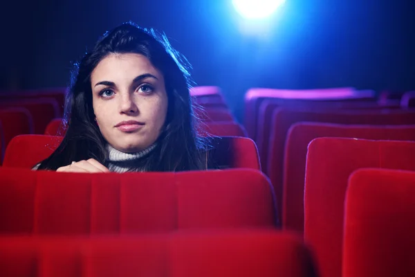 Portrait of a pretty young woman at cinema — Stock Photo, Image