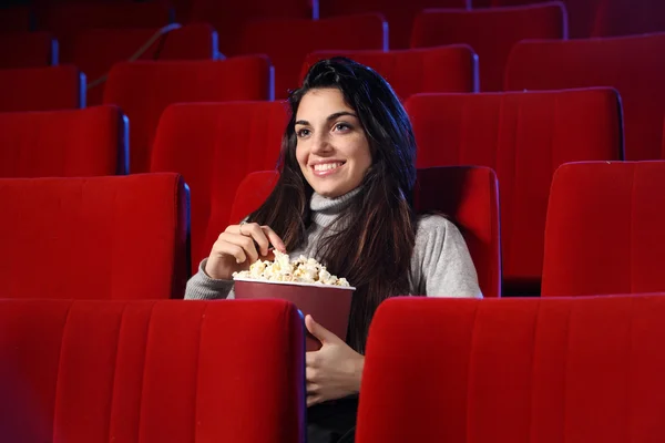 Funny movie: portrait of a pretty girl in an empty theater, she — Stock Photo, Image