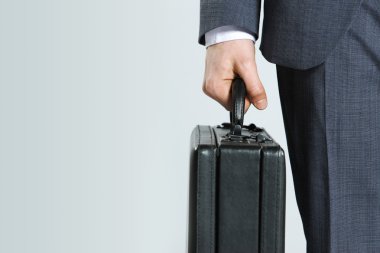 Businessman with suitcase, close up clipart