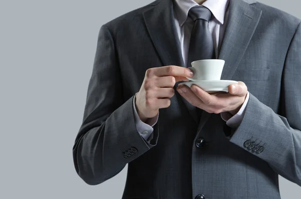 Закрыть бизнесмена чашкой кофе — стоковое фото