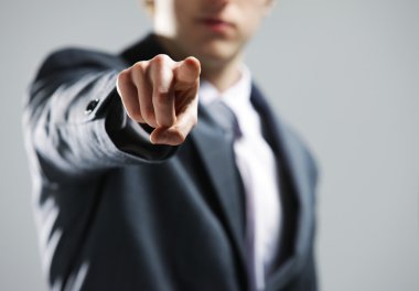 Businessman hand pointing out at you