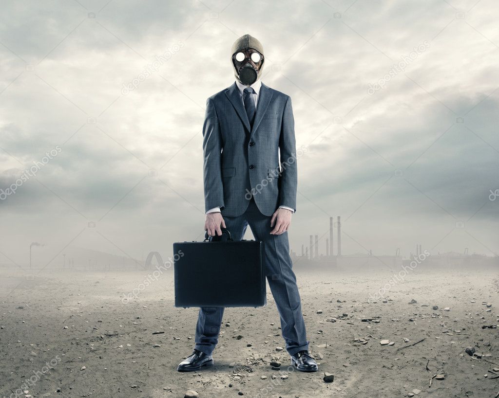 Doomsday: portrait of businessman in a gas mask with suitcase