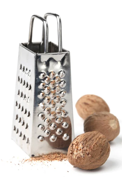 stock image Nutmegs and grater