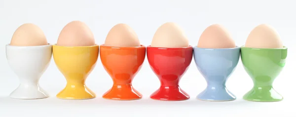 Eggcups s vejci — Stock fotografie