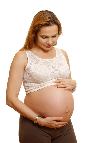 Zwangere vrouw. geïsoleerd op wit. — Stockfoto