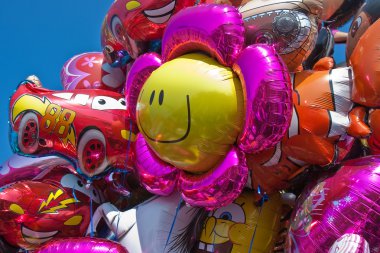 Colorful balloons wating for the kids at a party clipart