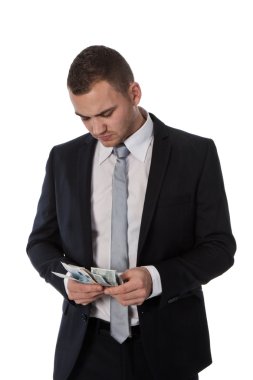 Businessman is counting money; isolated on white clipart