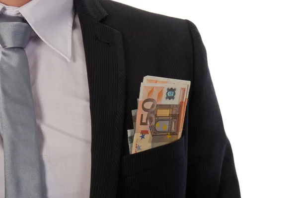 Zakenman met geld in zijn zak; geïsoleerd op whit — Stockfoto
