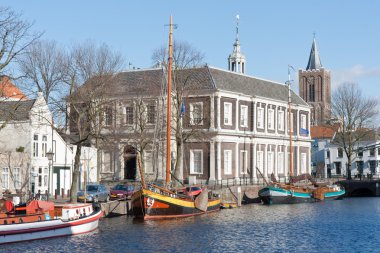 Traditional wooden barges in old historic harbor of Schiedam, Th clipart