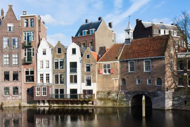 Historic cityscape along a channel in Delfshaven, a district of clipart