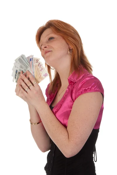 Mooie jonge vrouw met geld geïsoleerd op witte achtergrond — Stockfoto