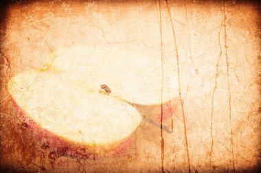 Grunge a background apple on an old beige wall clipart