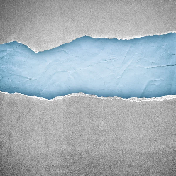 Rip gris final fondo de papel azul claro —  Fotos de Stock