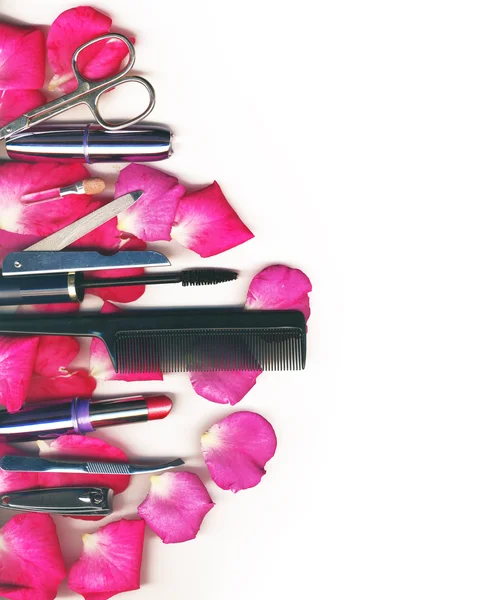 Makeup brush and cosmetics with pose petals — Stock Photo, Image