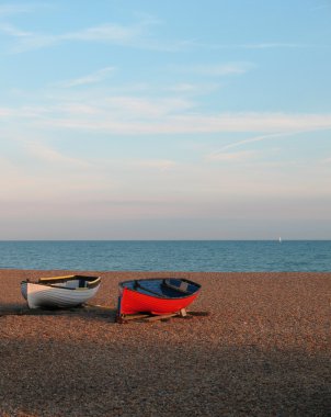 2 boats on the stone beach clipart