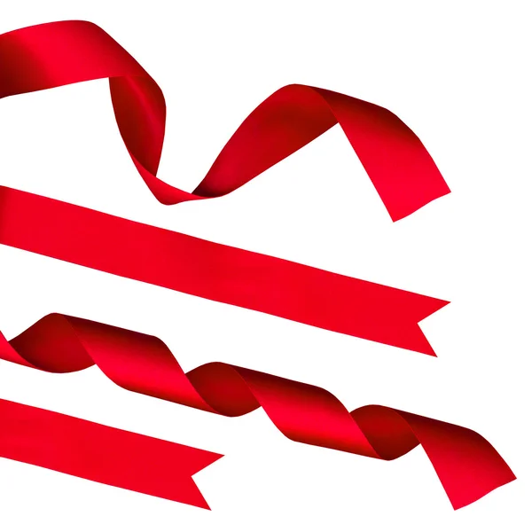 stock image Strips of red shiny ribbon and a bow over a white background with Clipping