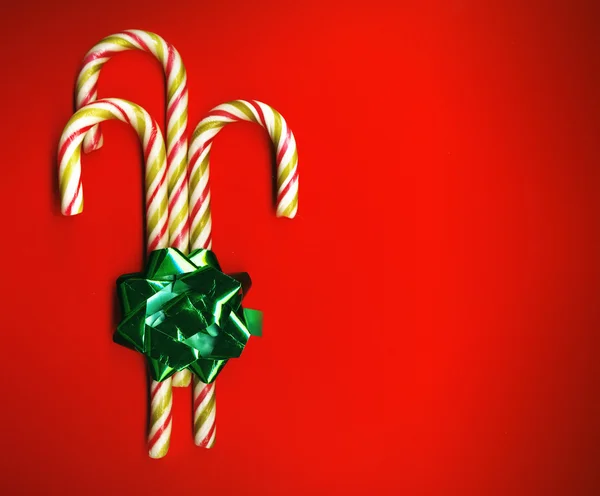 Candy cane with green bow — Stock Photo, Image