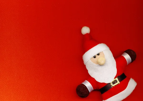 Jultomten på röd bakgrund — Stockfoto
