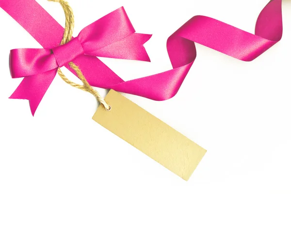 Pink ribbon with a label isolated on white — Stock Photo, Image