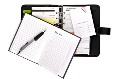 Busy personal organizer with things to do list (concept) clipart