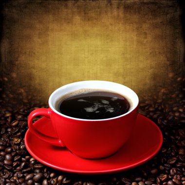 Cup of coffee on grunge textured background clipart