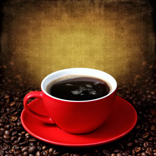 Cup of coffee on grunge textured background — Stock Photo, Image