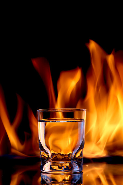 Fire water, strong alcoholic drink concept