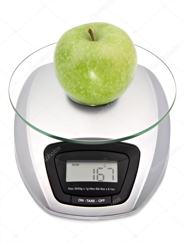 Digital kitchen scale with green apple