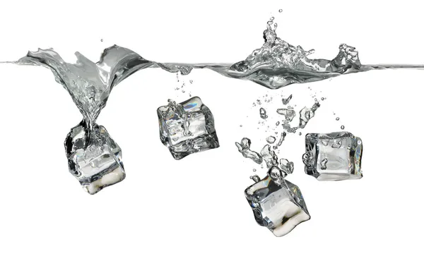 Ice cubes splashing into water Royalty Free Stock Photos
