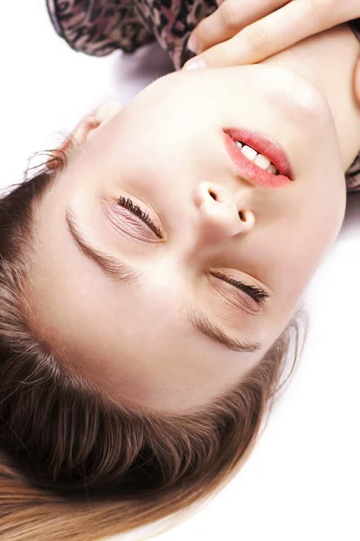 Sensual young woman posing while lying on floor — Stock Photo, Image